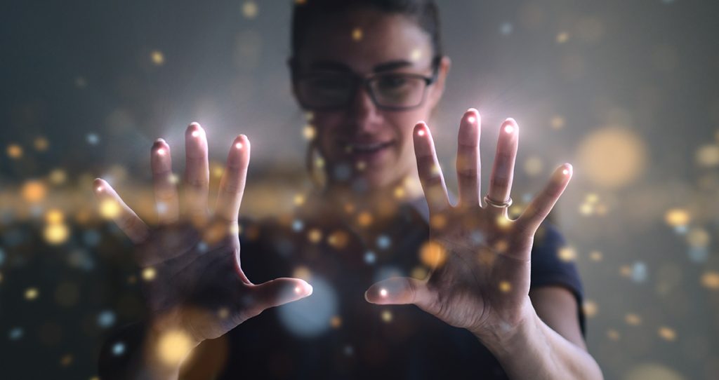 Person wearing glasses with hands spread open, overlayed with spots of light explainging the three e's